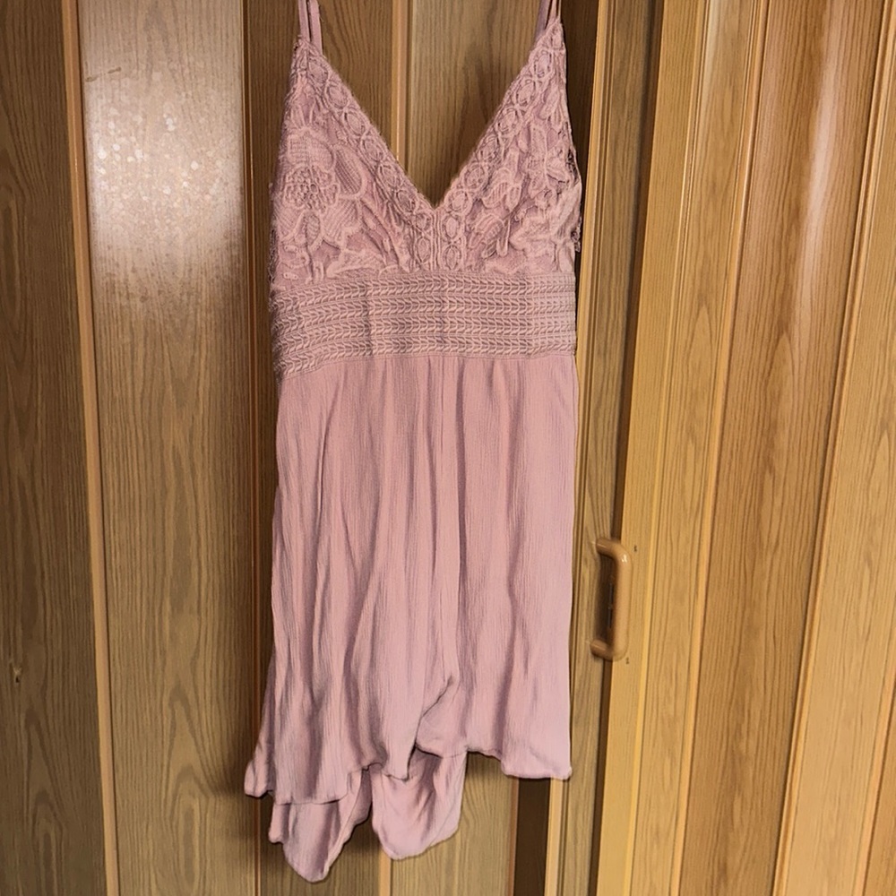 Woman’s pink lace romper